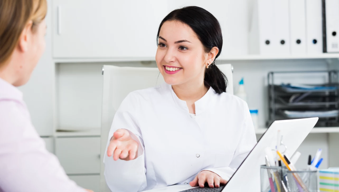 Deaf person communicating at health center