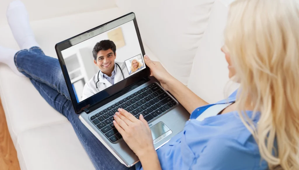 A woman having a video call with a health professional