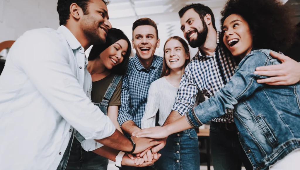 Group of people holding hands