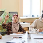 Group of people having a conversation around a table