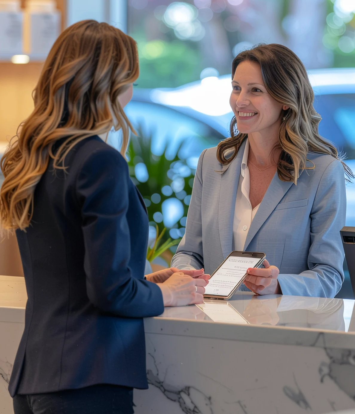 Two people using an iPad to communicate in different languages